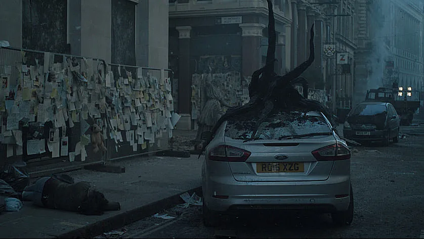 an image of damaged car sue to allien attacks in invasion season 2